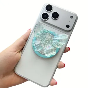 Close-up detail of iridescent laser butterfly acrylic phone grip attached to phone