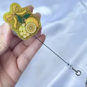 Porte-badge rétractable en acrylique pailleté avec motif citron jaune et joli nœud de ruban