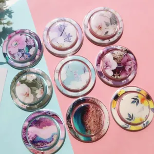 Detailed macro view showing various floral and marble painted resin air cushion phone grips