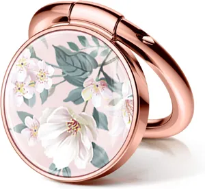 Close-up of rose gold phone ring holder with delicate white floral epoxy insert