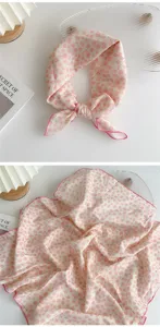Close-up detail of a cotton linen floral square scarf pink bandana headband neckerchief accessory.