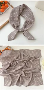 Detailed view of brown polka dot cotton linen small square scarf, elegant neckerchief.