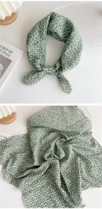 Detail shot of green and white geometric print linen cotton small square scarf, aesthetic.