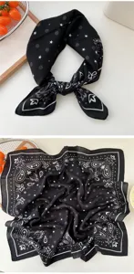 Detail view of the black cotton linen paisley square scarf with delicate stars pattern, elegant.