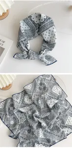 Detailed view of vintage blue paisley cotton linen square scarf showing exquisite print texture.