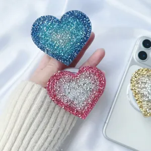 Sparkling heart rhinestone collapsible phone grip stand with magnetic attachment feature
