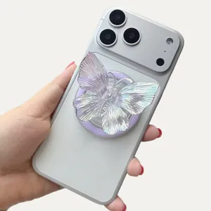 Close-up view of a laser holographic butterfly phone socket stand on a silver magnetic case