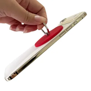 Magnetic ring phone holder stand with matte red finish attached to white smartphone