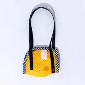 Portable breathable mesh bird carrier bag with yellow and checkered design for small parrots.