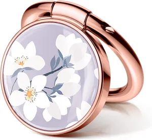 Detailed macro shot of rose gold phone ring holder featuring elegant white floral resin inlay