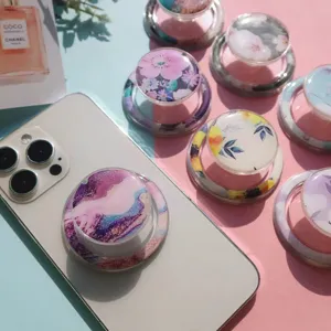 Close-up view of elegant floral and marble resin magnetic phone grip stands for desk