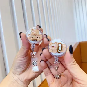 Detail view of cute glitter cartoon bear retractable badge reels for ID cards