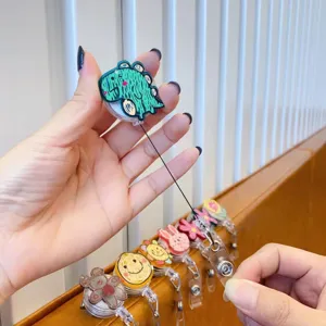 Retractable badge reel with cute cartoon doodle design and sturdy alligator clip