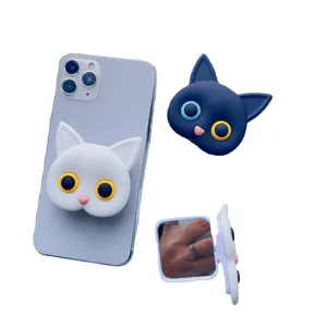 Cute cat-shaped collapsible phone grip and portable makeup mirror in white and black.