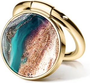 Detail of golden circular phone ring holder with blue and gold marble epoxy pattern