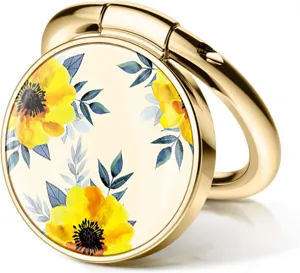 Detailed close-up view of a golden circular phone ring holder featuring a yellow poppy floral print