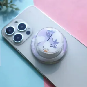 Macro shot of a floral magnetic phone grip with glue-drop finish on a phone