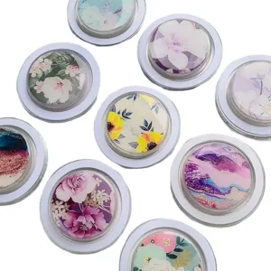 Collection of floral and marble pattern mobile phone grip sockets with glossy finish.