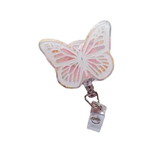 Retractable butterfly badge reel featuring gold foil and pink floral epoxy resin design