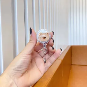 Close-up of a cute glittery bear retractable badge holder for nurses and doctors