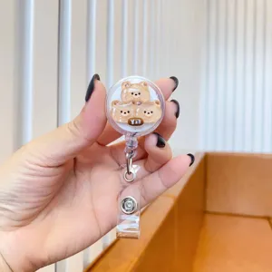 Detailed view of a cute cartoon bear retractable badge reel ID holder with glitter detail