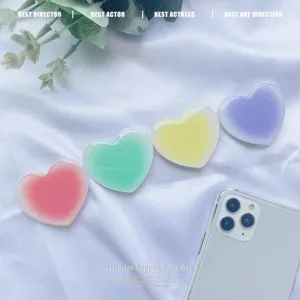 Four cute pastel gradient heart-shaped retractable phone grips on white silk background