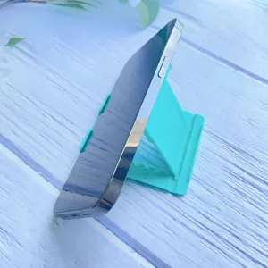 Durable teal adjustable foldable desktop phone stand shown at a side angle view detail