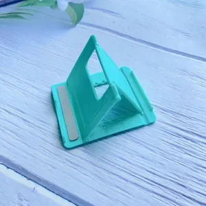 Detail showing adjustable angles on mint green foldable desktop phone and tablet stand