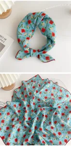 Detailed view of the blue floral cotton linen small square scarf, delicate red flower print.