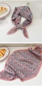 Pink pleated square scarf with vintage print, elegant women fashion accessory detail view.