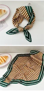 Detailed view of pleated square scarf with green and brown geometric striped print fabric.
