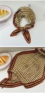 Pleated square scarf with geometric stripe pattern, elegant women accessory for spring and summer.