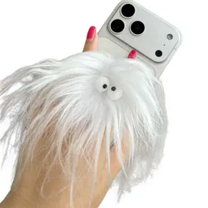 Detailed macro view of a fluffy white plush monster pop-up phone grip on a smartphone
