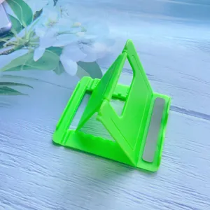 Bright green adjustable foldable phone and tablet stand with grey non-slip pads detail