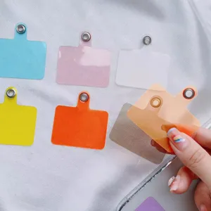 Universal phone lanyard tether tabs in various colors for case strap attachment
