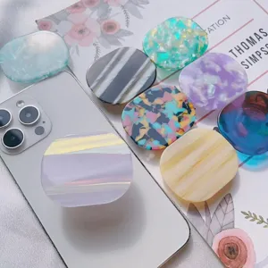Collezione di supporti per telefono pieghevoli in acetato colorato marmorizzato e a righe