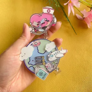 Detail view of acrylic shaker badge reels with nurse and travel themes