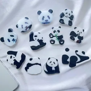Various cute panda-themed acrylic air cushion phone grips in multiple poses