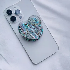 Heart-shaped MagSafe phone grip with colorful natural abalone shell resin finish.