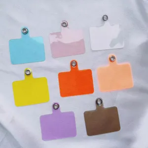 Close-up of universal phone lanyard tether tabs shown in various vibrant colors for cases