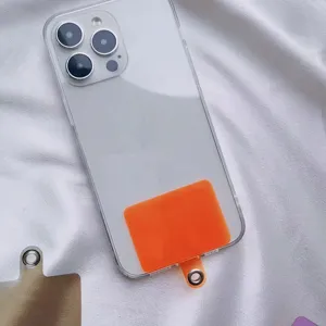 Close-up of orange universal phone lanyard gasket inside a clear case