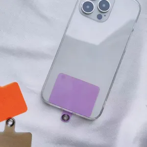 Close-up of a purple universal phone lanyard gasket insert inside a clear phone case.