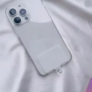 Detailed macro view of a clear universal phone lanyard gasket patch inside a phone case