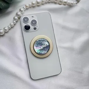 Elegante supporto per telefono magnetico con trama a conchiglia e bordo dorato di lusso