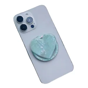 Mint green heart-shaped phone grip with natural scallop shell pattern for MagSafe magnetic stand