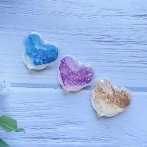 Funkelnde Herzform-Handyhalterungen mit Glitzersand in Blau, Violett und Goldtönen