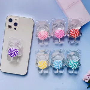 Vista dettagliata di vari supporti per cellulare a forma di orsetto con lecca-lecca colorati