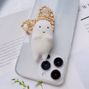 Close-up of a cute white ghost squishy phone grip stand attached to a clear case