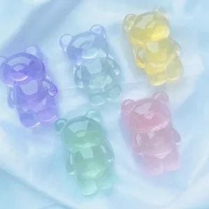 Vue détaillée de supports de téléphone ours en résine translucide colorée