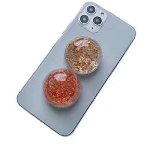 Supporto per telefono a sfera di cristallo glitterata per una presa sicura dello smartphone
